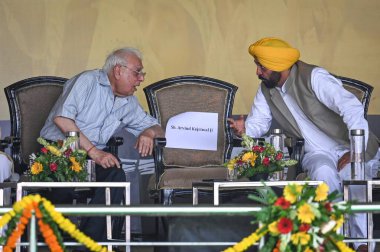 NEW DELHI INDIA JUNE 11 2023 Senior Leader Kapil Sibal along with Bhagwant Mann Chief minister of Punjab during the mega rally organized at Delhi s Ramlila Maidan against the Centre s Ordinance on control over administrative services on June 11 2023  clipart