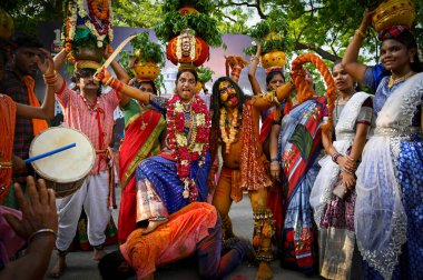 NEW DELHI INDIA JUNE 20 2023 People of Telangana celebrating and dancing during the Lal Darwaza Bonalu celebrations at Telangana Bhawan on June 20 2023 in New Delhi India Bonalu is celebrated usually during Ashada Masam which falls in July August Spe clipart