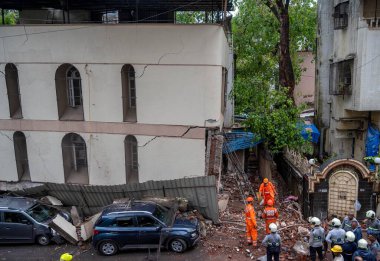 MUMBAI INDIA JUNE 25 2023 National Disaster Response Force NDRF personnel look for survivors at a Prashant building collapse site at Ghatkopar on June 25 2023 in Mumbai India Photo by Satish Bate Hindustan Times clipart