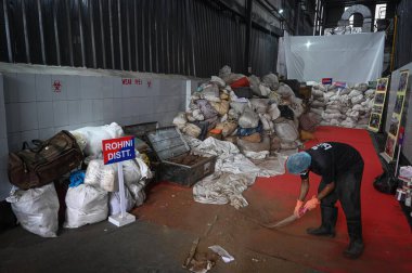 NEW DELHI INDIA JUNE 26 2023 A worker seen during a Mass drug destruction program on the occasion of International Day against Drugs Abuse and Illicit Trafficking organized by Delhi Police at a Facility in SSI Industrial Area Jahangirpuri on June 26  clipart