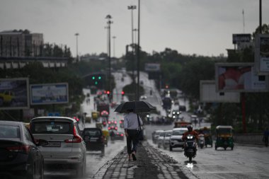 NEW DELHI INDIA JUNE 29 2023 Commuters out on a rainy day at Kirti Nagar on June 29 2023 in New Delhi India Photo by Sanchit Khanna Hindustan Times clipart