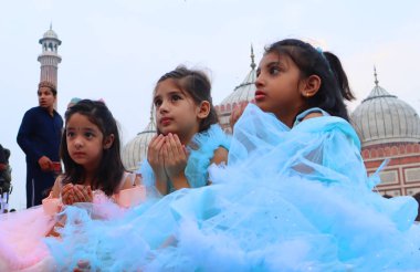 NEW DELHI INDIA JUNE 29 2023 Children playing after offering namaz at historic Jama Masjid on the occasion of Eid al Adha in Old Delhi on June 29 2023 in New Delhi India Eid ul Adha also known as Bakra Eid Bakrid Eid al Adha Eid Qurban or Qurban Baya clipart