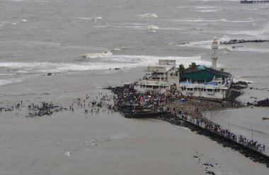 MUMBAI INDIA JUNE 30 2023 A large crowd of Muslim worshipers thronging the pathway leading to iconic Haji Ali Dargah on the second day of Bakri Eid at Mahalaxmi on June 30 2023 in Mumbai India Photo by Bhushan Koyande Hindustan Times clipart