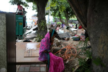 NEW DELHI INDIA JUNE 1 2023 People are seen next to demolished makeshifts after an anti encroachment drive being carried near Pragati Maidan by PWD at Bhairon Marg on June 1 2023 in New Delhi India The government s public works department PWD on Thur clipart