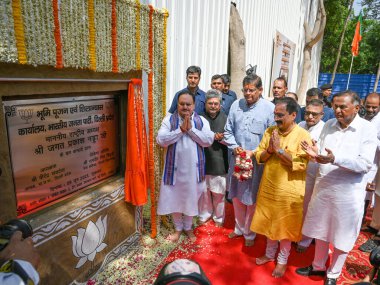 NEW DELHI INDIA JUNE 9 2023 BJP National President JP Nadda along with Delhi BJP president Virendra Sachdeva lay the foundation stone for the new Delhi BJP Office Building at Pocket 5 Deen Dayal Upadhyay Marg on June 9 2023 in New Delhi India Photo b clipart