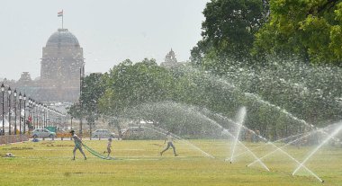 NEW DELHI INDIA JUNE 12 2023 Commuters seen out on a hot summer day at Kartavya path as the heat wave conditions prevailed in Northern India with the maximum temperature settling at 40 degrees Celsius on June 12 2023 in New Delhi India Photo by Sonu  clipart