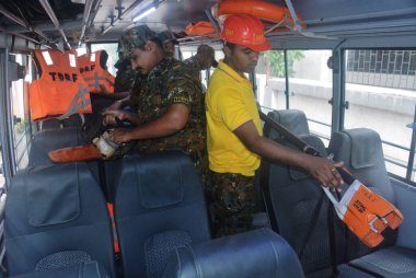 THANE INDIA JUNE 13 2023 Thane Disaster Response Force TDRF personnel gearing up with rescue operation equipment as Thane Municipal Corporation TMC instructs the force to remain alert in the wake of Cyclone Biporjoy intensifying into severe cyclonic  clipart