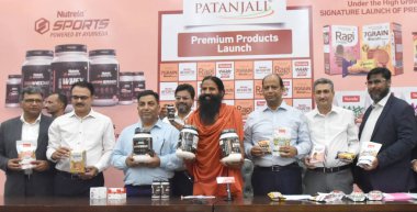 NEW DELHI INDIA JUNE 16 2023 Yoga Guru Baba Ramdev and Patanjali Foods CEO Sanjeev Asthana and others during the launch of Patanjali premium products at Constitution Club of India on June 16 2023 in New Delhi India The products includes Nutrela Max M clipart