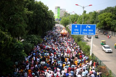 NEW DELHI INDIA JUNE 20 2023 Devotees take part in the annual Jagannath Rath Yatra the festival of chariots at Hauz Khas on June 20 2023 in New Delhi India The Jagannath Puri Rath Yatra is an annual festival celebrated in the city of Puri Odisha The  clipart