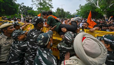 NEW DELHI INDIA JUNE 27 2023 Delhi Police detain a member of Akhil Bharatiya Vidyarthi Parishad ABVP Students union during the protest near Delhi Chief Minister Arvind Kejriwal s residence against the alleged unauthorised coaching classes around nort clipart