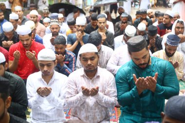 GHAZIABAD INDIA JUNE 29 2023 Muslims devotees pray Eid ul Azha Namaz during rain at Kella Bhatta Eidgah on June 29 2023 in Ghaziabad India Eid ul Adha also known as Bakra Eid Bakrid Eid al Adha Eid Qurban or Qurban Bayarami is Islamic festivals celeb clipart