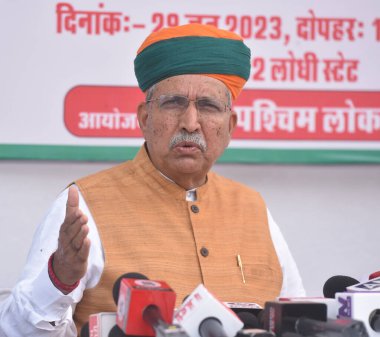 NEW DELHI INDIA JUNE 29 2023 Minister of Law and Justice and Minister of State for Parliamentary Affairs and Culture Arjun Ram Meghwal addressing a press conference on the completion of 9th Year Modi Government development of North Delhi Lok Sabha Co clipart