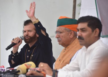 NEW DELHI INDIA JUNE 29 2023 Member of Parliament North West Delhi Hans Raj Hans along with Minister of Law and Justice and Minister of State for Parliamentary Affairs and Culture Arjun Ram Meghwal and others addressing a press conference on the comp clipart