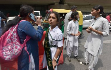 NEW DELHI INDIA APRIL 26 2023 Parents with their children leave after receiving a bomb threat at Delhi Public School DPS Mathura Road on April 26 2023 in New Delhi India A 16 year old teenager who sent the hoax bomb mail to Delhi Public School on Apr clipart