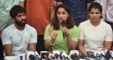 NEW DELHI INDIA MAY 2 2023 Wrestlers Bajrang Punia Vinesh Phogat and Sakshi Malik speak with the media during the protest dharna against the Wrestling Federation of India president Brij Bhushan Saran at Jantar Mantar on May 2 2023 in New Delhi India  clipart