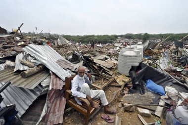 NEW DELHI INDIA MAY 2 2023 Locals seen taking out their valuables from the demolished structures as ASI along with the district administration carries out demolishing drive of illegal constructions near Tughlaqabad Fort on May 2 2023 in New Delhi Ind clipart