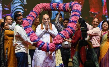 NEW DELHI INDIA MAY 3 2023 NDMC employees greets the Union Home Minister Amit Shah with a garland during the present the appointment letters to NDMC staff at Talkatora Indoor Stadium on May 3 2023 in New Delhi India Amit Shah  clipart