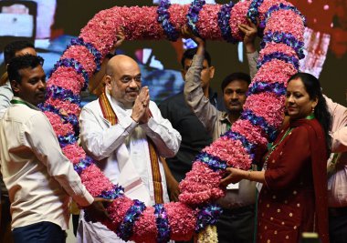 NEW DELHI INDIA MAY 3 2023 NDMC employees greets the Union Home Minister Amit Shah with a garland during the present the appointment letters to NDMC staff at Talkatora Indoor Stadium on May 3 2023 in New Delhi India Amit Shah  clipart