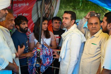 NEW DELHI INDIA MAY 4 2023 Jayant Chaudhary RLD leader joins the Indian Wrestlers in support of their protest against the President of Wrestling Federation of India at Jantar Mantar on May 4 2023 in New Delhi India Speaking to the media the grapplers clipart