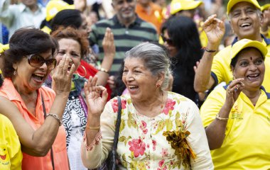 MUMBAI INDIA MAY 7 2023 On the occasion of World Laughter Day people from the various parts of the city gather and participate to celebrate organized by Cuffe Parade Residents Association at Bayview Marina Garden Cuffe Parade on May 7 2023 in Mumbai  clipart