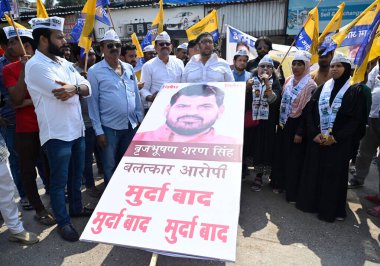 MUMBAI INDIA MAY 6 2023 Aam Admi Party AAP workers protest against Wrestling Federation of India WFI president and BJP MP Brij Bhushan Sharan Singh over allegations of sexual harassment by Indian women wrestlers at Kadam Nagar Behram Baug Jogeshwari  clipart