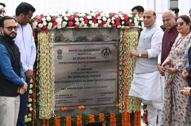 CHANDIGARH INDIA MAY 8 2023 Defense Minister Rajnath Singh White dress along with Governor Punjab Administrator UT Chandigarh Banwari Lal Purohit Maroon Jacket MP Chandigarh Kirron kher and other dignitaries inaugurated the Raipur Kalan Gaushala on M clipart