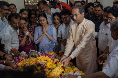 MUMBAI INDIA MAY 9 2023 Shiv Sena UBT chief Uddhav Thackeray and along with other Shiv Sainiks attends the funeral of senior Shiv Sena UBT leader and former Mumbai Mayor Vishwanath Mahadeshwar at Santacruz on May 9 2023 in Mumbai India Photo by Satis clipart