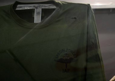 CHANDIGARH INDIA MAY 10 2023 T Shirt worn by Squadron Leader S Jhajhria Shaurya Chakra during Operation Naira 29 30 Jan 2022 at Pulwama Jammu and Kashmir in which he received two Gun Shot Wounds Displayed at the Indian Air Force Heritage Museum at se clipart