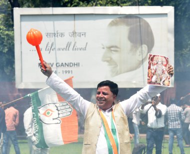 NEW DELHI INDIA MAY 13 2023 Congress workers and supporters celebrate after winning the Karnataka Assembly Election at AICC HQ on May 13 2023 in New Delhi India Congress has won 135 seats well above the majority mark of 113 seats in a 224 seat state  clipart