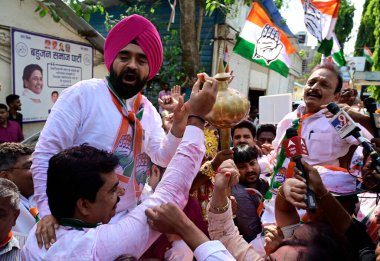 MUMBAI INDIA MAY 13 2023 Congress workers celebrate the victory after the party sweeps Karnataka assembly elections with absolute majority at MRCC Office Azad Maidan on May 13 2023 in Mumbai India Congress has won 135 seats well above the majority ma clipart