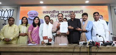 NEW DELHI INDIA OCTOBER 30 2024 Delhi BJP president Virendra Sachdeva along with Delhi MPs addressing the media person on the issue of Delhi health Ayushman scheme at Delhi BJP office on October 30 2024 in New Delhi India Delhi BJP MPs have taken leg clipart