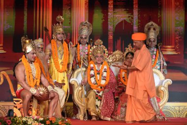 AYODHYA INDIA OCTOBER 30 2024 Uttar Pradesh Chief Minister Yogi Adityanath welcomes lord Ram Laxman and Sita after receiving them from Pushpak Vimaan Helicopter at the bank of Saryu river on the occasion of Deepotsav on October 30 2024 in Ayodhya Ind clipart