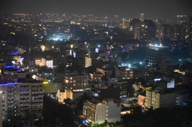 GURUGRAM, INDIA OCTOBER 30 2024 The Gurugram city DLF area is illuminated on the eve of Diwali festival on October 30 2024 in Gurugram India  clipart