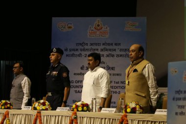 NEW DELHI INDIA MAY 15 2023 Flag off ceremony of 1st NDRF Mountaineering expedition SAAHAS to Bhagirathi 2 by Chief Ajay Kumar Mishra Minister of State for Home Affairs Government of India clipart