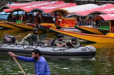 SRINAGAR INDIA MAY 17 2023 Navy s Marine Commandos MARCOS patrol ahead of upcoming G20 meeting in Dal Lake on May 17 2023 in Srinagar India Photo By Waseem Andrabi Hindustan Times clipart