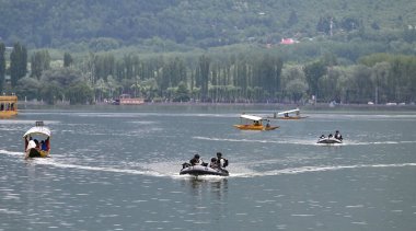 SRINAGAR INDIA MAY 18 2023 Indian Navy s Marine Commandos patrol on the waters of Dal Lake on May 18 2023 in Srinagar India Security is being beefed up ahead of the G20 Tourism Working Group meeting of delegates from G20 nations is being held in Srin clipart