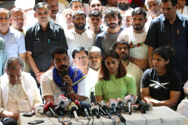 NEW DELHI INDIA MAY 15 2023 Indian Wrestlers Sakshi Malik Vinesh Phogat along with Bhim Army Chief Chndra Shekhar Azad during the press conference addressing at the ongoing protest against the WFI Chief Brij Bhushan Singh at Jantar Mantar on May 15 2 clipart