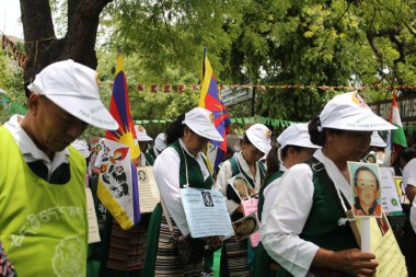 NEW DELHI INDIA MAY 17 2023 Tibetan Women association hold placards during their protest against the Chinese government on the 28 year of the enforced disappearance of the 11th Panchen Lama Tenzin Gendun Yeshi Thinley Phuntsok at Jantar Mantar on May clipart