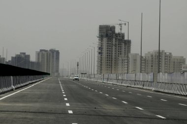 GURUGRAM INDIA MAY 18 2023 A view of Dwarka expressway near sector 99 99A on May 18 2023 in Gurugram India The minister said that the highway which is India s first access controlled eight lane expressway is part of the ?60 000 crore Delhi decongesti clipart