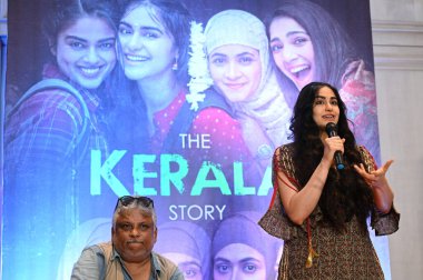 KOLKATA INDIA MAY 13 2023 Bollywood actor Adah Sharma with director Sudipto Sen interact with media for the promotion of The Kerala Story movie at JW Marriott Hotel clipart