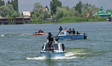 SRINAGAR INDIA MAY 20 2023 Central Reserve Police Forces CRPF Quick Action Team conducting a security drill in the waters of Dal Lake ahead of the G20 Tourism group meeting clipart