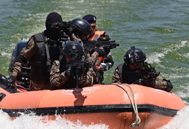 SRINAGAR INDIA MAY 20 2023 Central Reserve Police Forces CRPF Quick Action Team conducting a security drill in the waters of Dal Lake ahead of the G20 Tourism group meeting clipart