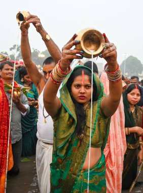 GURUGRAM INDIA NOVEMBER 8 2024 Hindu devotees offer prayers and performing rituals to the God Sun during rising to mark Chhath Puja Festival at Sheetla Mata Mandir parking site sector 5 road in Gurugram India on Friday 08 November 2024  clipart