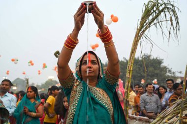 GURUGRAM INDIA NOVEMBER 8 2024 Hindu devotees offer prayers and performing rituals to the God Sun during rising to mark Chhath Puja Festival at Sheetla Mata Mandir parking site sector 5 road in Gurugram India on Friday 08 November 2024  clipart