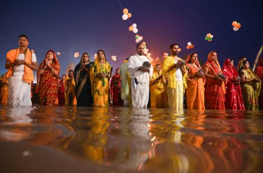 GURUGRAM INDIA NOVEMBER 8 2024 Hindu devotees offer prayers and performing rituals to the God Sun during rising to mark Chhath Puja Festival at Sheetla Mata Mandir parking site sector 5 road in Gurugram India on Friday 08 November 2024 Photo by Parve clipart