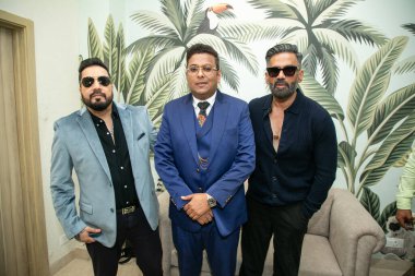 NEW DELHI INDIA OCTOBER 13 2024 Bollywood actor Suniel Shetty and singer Mika Singh with ICI founding member Dr Tarang Krishna C during the inauguration of ICI Indian Cancer Institutes research and treatment hospital on October 13 2024 clipart