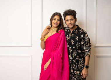 MUMBAI INDIA OCTOBER 16 2024 TV actor Surbhi Chandna and her husband entrepreneur Karan Sharma pose during an exclusive interview on Karwa Chauth shoot clipart