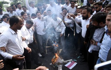 GHAZIABAD INDIA NOVEMBER 12 2024 The lawyers for the second consecutive day blocked the Hapur Road and burnt effigy while they also damaged a car of commuter as police did not roped in diversions on November 12 2024 in Ghaziabad India Lawyers are pro clipart