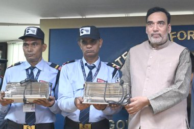 NEW DELHI INDIA NOVEMBER 12 2024 Delhi Environment minister Gopal Rai distribute the Electric Heater to Night Guard at Delhi Secretariat under winter action Plan on November 12 2024 in New Delhi India In addition to RWAs all govt departments in Delhi clipart