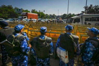 NEW DELHI INDIA DECEMBER 2 2024 Delhi Police and RAF Security personnel deployed at Delhi Noida Chilla border after security was heightened in view of farmers' protest march towards the national capital on December 2 2024 in New Delhi India Photo by  clipart